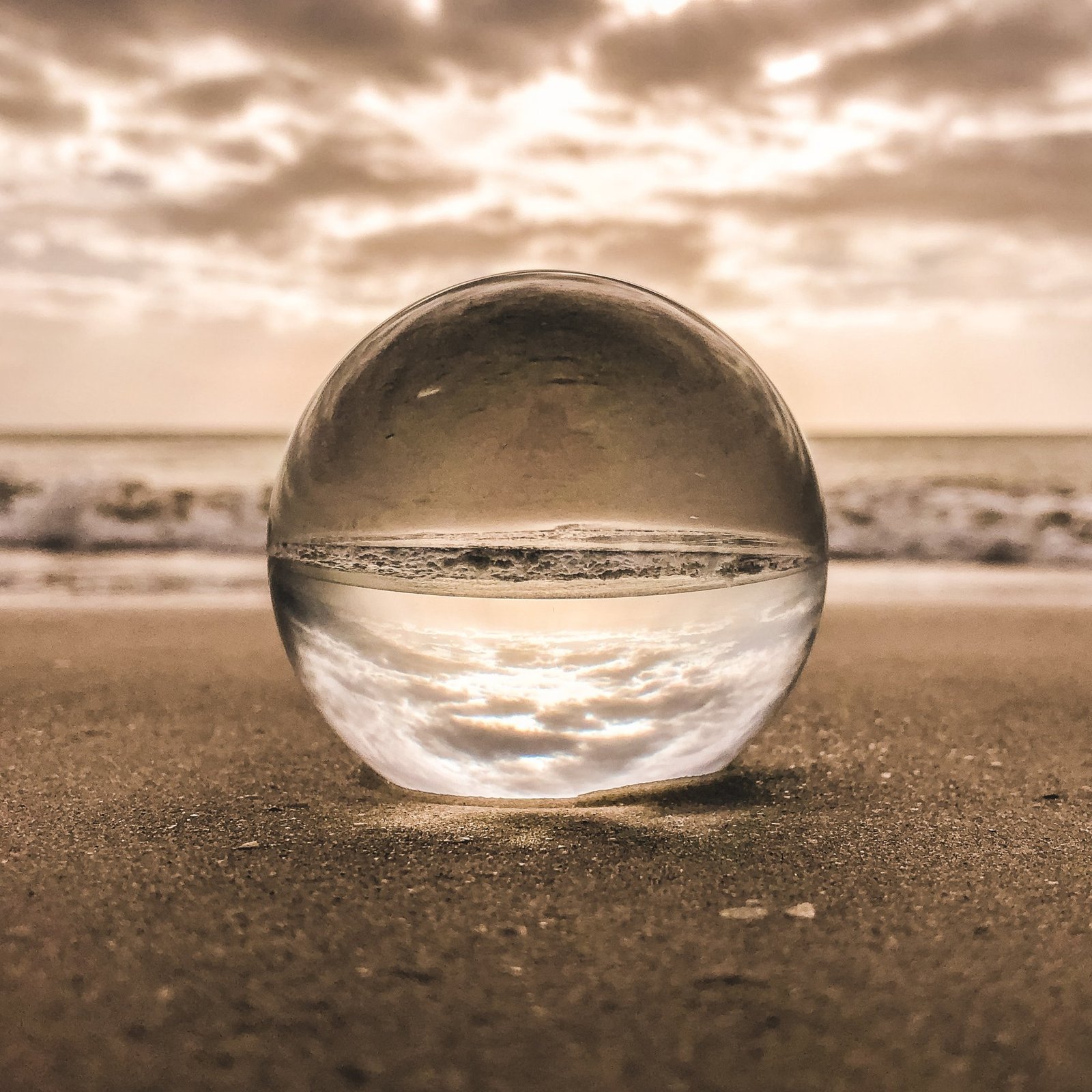 A glass sphere reflecting the sea, from Joanna's website